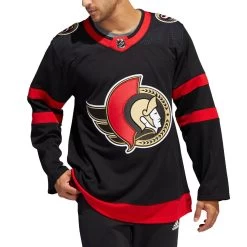 BRADY TKACHUK OTTAWA SENATORS ADIDAS ADIZERO PRIMEGREEN AUTHENTIC BLACK HOME JERSEY -Professional Hockey Equipment Store OTTAWA SENATORS ADIDAS ADIZERO PRIMEGREEN AUTHENTIC BLACK HOME JERSEY MODEL FRONT 1024x1024 1abf8e93 460e 4d6c b760 885ada992152